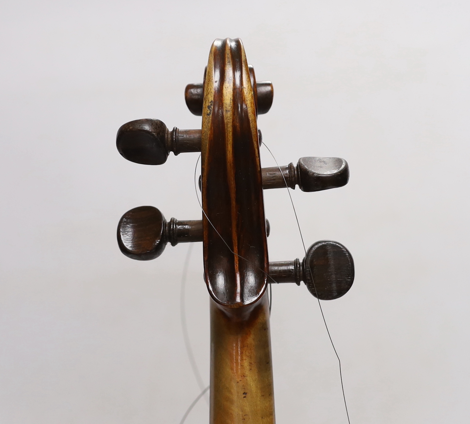 A violin labelled 'Albani Palermo', cased, length of back 35.5cm